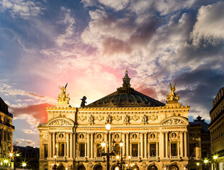 Fototapeta na wymiar Opera Garnier (Garnier Palace) against the background of a beautiful sky at sunset, Paris, France. Translation: national Academy of Music. UNESCO World Heritage Site
