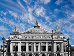 Naklejka premium Opera Garnier (Garnier Palace) against the background of a beautiful sky with clouds, Paris, France. Translation: national Academy of Music. UNESCO World Heritage Site