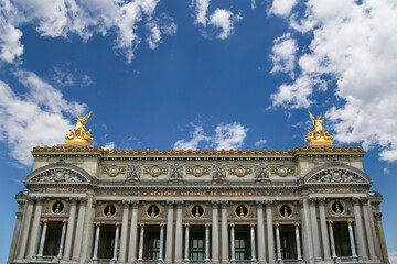 Fototapeta na wymiar Opera Garnier (Garnier Palace) against the background of a beautiful sky with clouds, Paris, France. Translation: national Academy of Music. UNESCO World Heritage Site