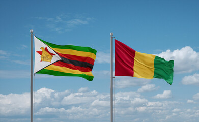 Guinea and Zimbabwe flags, country relationship concept