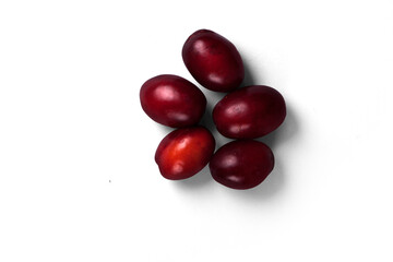 Close up view of isolated fresh red plums.