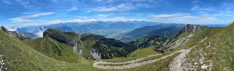 Fototapeta na wymiar Swiss Alpine Panorama from Mount Pilatus, Switzerland with Winding Hiking Trail