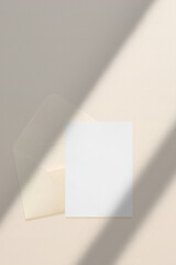 Wedding stationery invitation card mockup 5x7 and beige envelope on neutral beige background,...