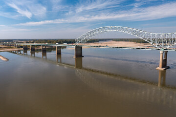 Extreme low water conditions on Mississippi river under Hernando do Soto bridge in Memphis TN in October 2023