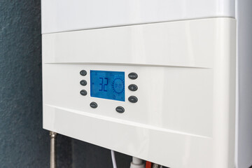 Close up of smart control panel of gas boiler for winter home heating and hot water. Modern house device
