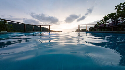 View of the mountains, sunset from a swimming pool