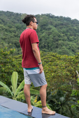 Man standing looking at the mountains