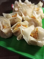 A plate of dim sum ready to eat.
