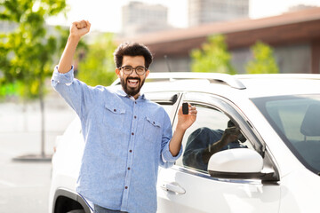 Rich millennial hindu man buying auto at luxury dealership salon