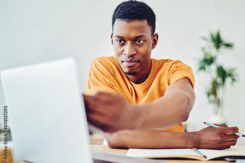 Poster dark skinned students watching tutorial while making coursework project