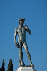 Michelangelo's David bronze statue in a public square of Florence, Italy