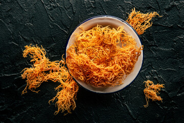 Irish sea moss on a black slate background, Chondrus Crispus, healthy organic food supplement,...