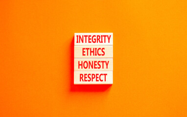 Integrity ethics honesty respect symbol. Concept word Integrity Ethics Honesty Respect on beautiful block. Beautiful orange table orange background. Business integrity ethics honesty respect concept.