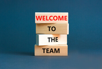 Welcome to the team symbol. Concept words Welcome to the team on wooden block. Beautiful white table white background. Business, motivational and welcome to the team concept. © Dzmitry