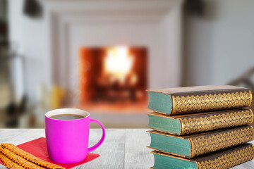Winter christmas books background. A stack of antique books with a coffee mug and Italian pastries...