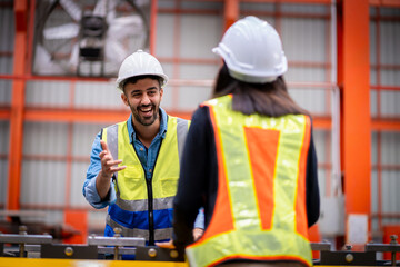 Young male engineer in metal sheet factory Responsible work is being inspected at the actual work site