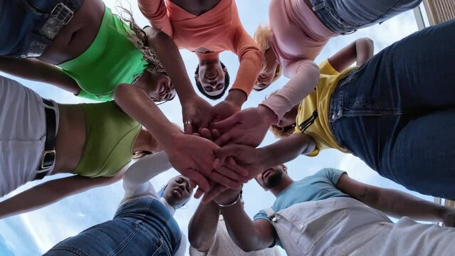 hands, team building, motivation - a group of millenials
