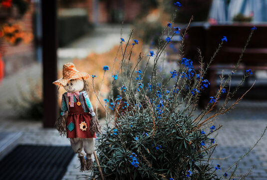 straw doll as garden decoration 