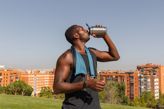 Man hydrating after outdoor exercise