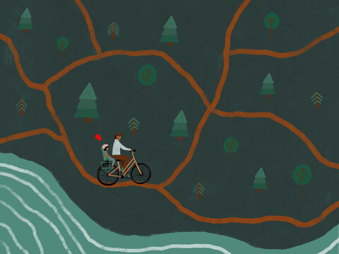 Man cycling with child and balloon in forest