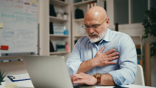 Businessman feeling discomfort in chest, risk of heart failure, chronic illness