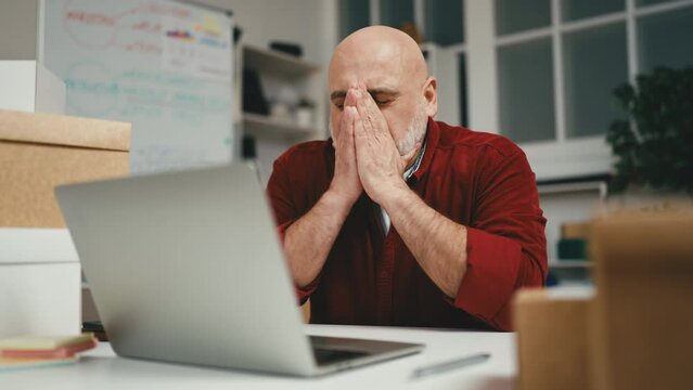 Man feeling upset, bad day at work, lost deal or client, small business owner