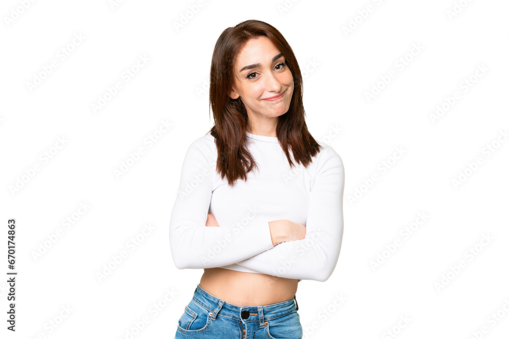 Wall mural Young caucasian woman over isolated chroma key background making doubts gesture while lifting the shoulders