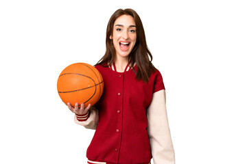 Young basketball player woman over isolated chroma key background with surprise facial expression