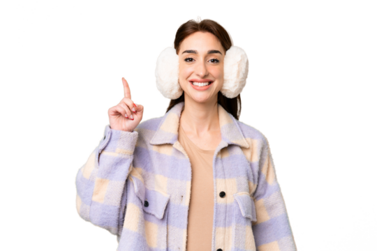 Young caucasian woman wearing winter muffs over isolated chroma key background pointing with the index finger a great idea