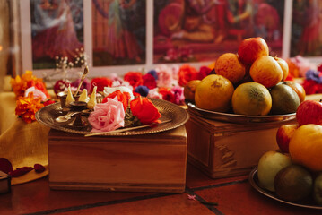Colourful Hindu altar with offerings for a kirtan celebration honoring Krishna an other deities of...