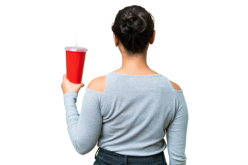 Young Uruguayan woman holding soda over isolated chroma key background in back position