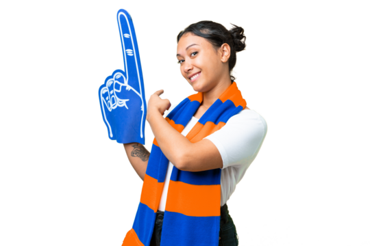 sports fan woman over isolated chroma key background pointing back