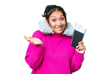 Young Uruguayan woman holding a passport over isolated chroma key background having doubts while...