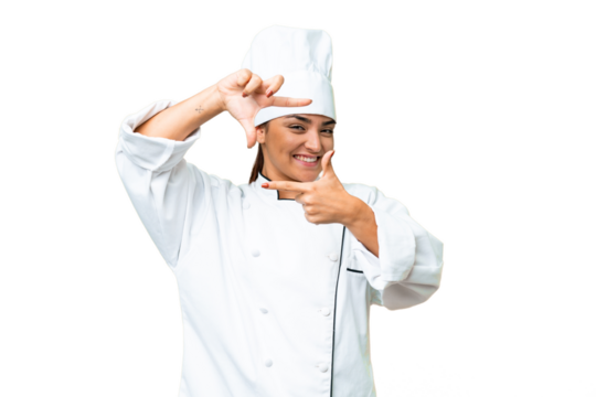 Young woman Chef over isolated chroma key background focusing face. Framing symbol