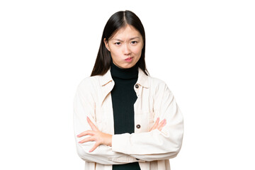 Young Asian woman over isolated chroma key background feeling upset