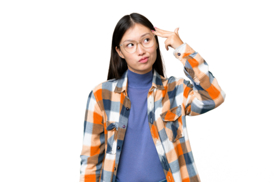 Young Asian woman over isolated chroma key background with problems making suicide gesture