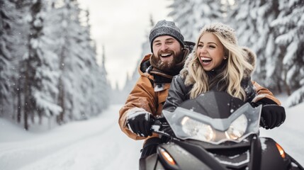 Portrait of happy couple riding on a snowmobile in the snowy forest - obrazy, fototapety, plakaty