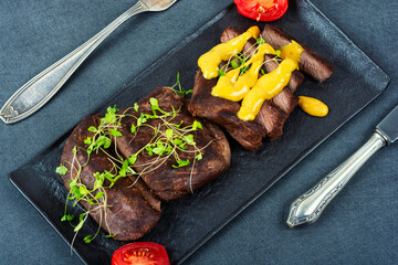 Fried ostrich steaks.