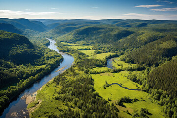 awe-inspiring aerial view of a vast, untouched wilderness from a bird's-eye perspective. From high above, you can see a meandering river winding through a dense, emerald-green forest