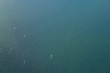 Aerial view on the Windmills in the middle of the sea