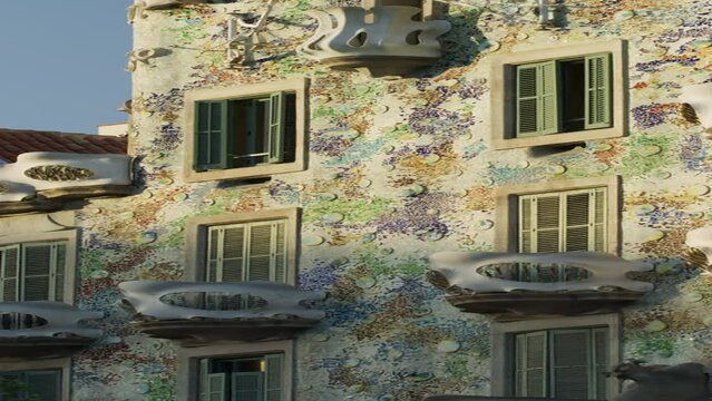 Tilt up to facade and arched roof of Casa Batllo  - vertical video / Barcelona, Barcelona, Spain