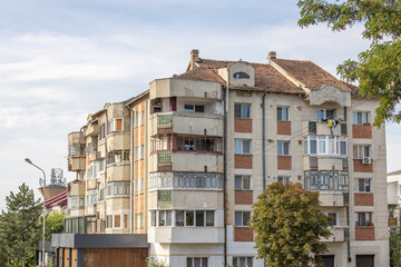 Old apartment block from communist era in Eastern Europe. Communist socialist architecture style flat. Dreary and depressive rust-eaten building. - obrazy, fototapety, plakaty
