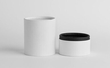 White paper covered box. Cylinder shaped perfume box. Box mockup design.