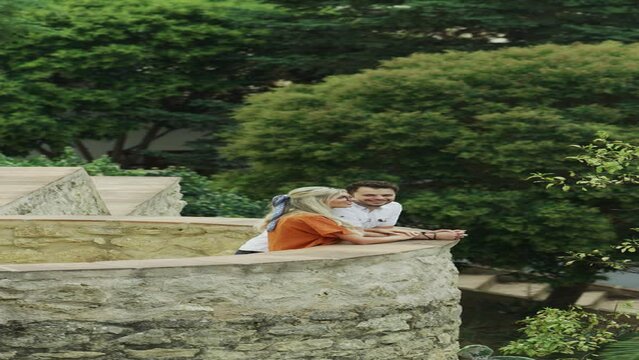 Couple posing for cell phone selfie at Jardines de Cuenca  - vertical video / Ronda, Malaga, Spain