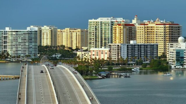 Aerial view of Sarasota city downtown with Ringling Bridge and high-rise office buildings on horizon. Real estate development in Florida. USA travel destination
