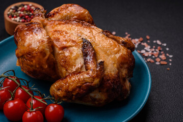 Crispy delicious whole baked chicken with vegetables, salt and spices