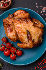 Crispy delicious whole baked chicken with vegetables, salt and spices