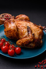 Crispy delicious whole baked chicken with vegetables, salt and spices