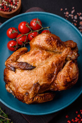 Crispy delicious whole baked chicken with vegetables, salt and spices