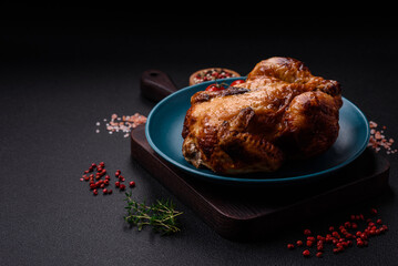 Crispy delicious whole baked chicken with vegetables, salt and spices